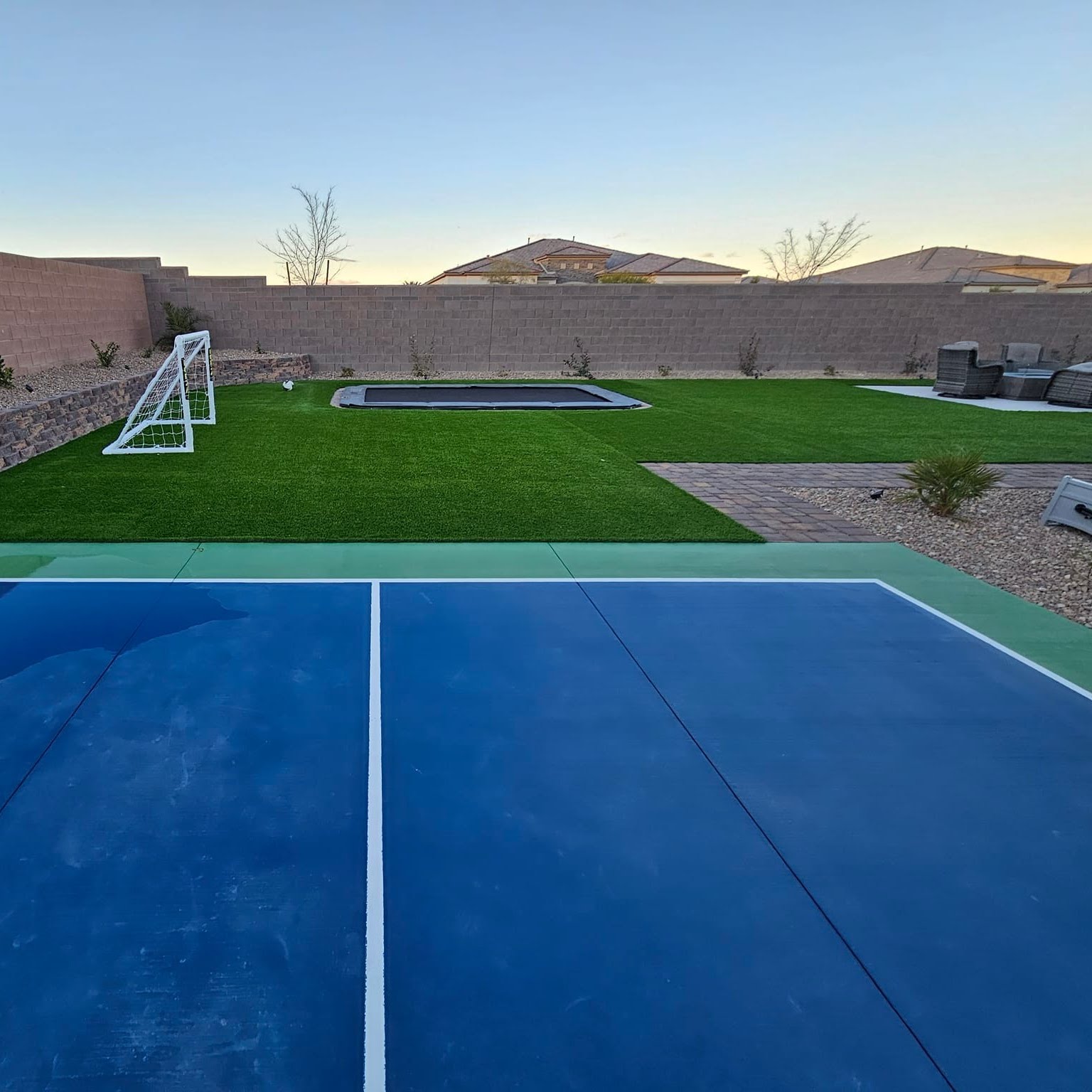 Backyard transformation with artificial turf and pavers in Las Vegas